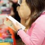 person looking at book