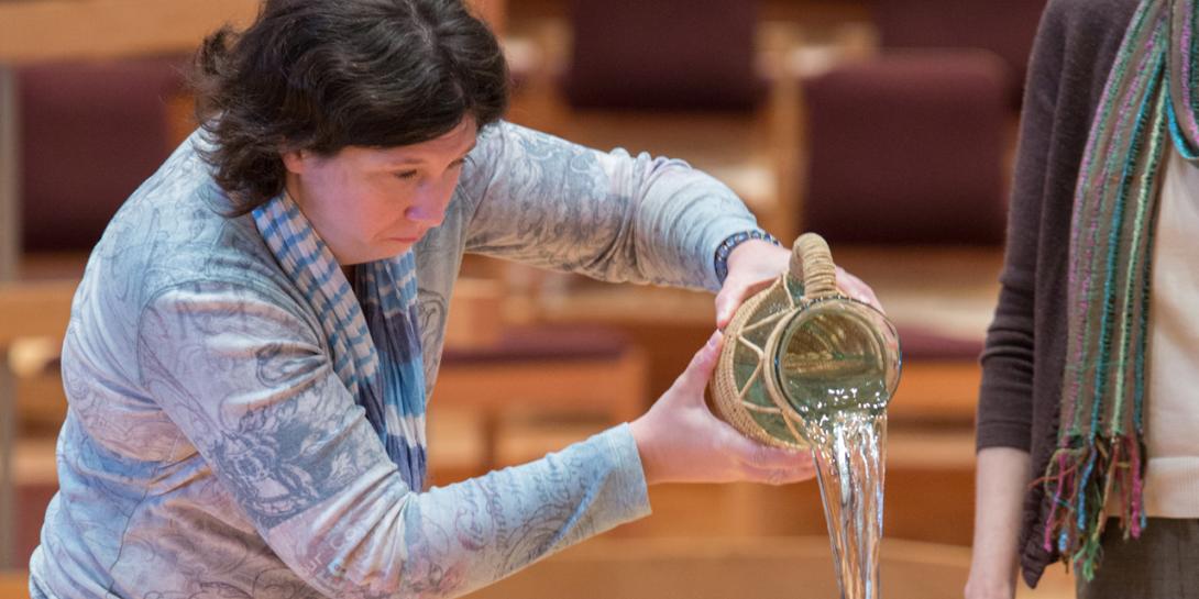 pouring baptismal water